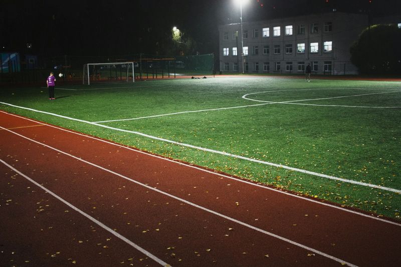 Floodlit pitch with a running track during the Speed Cup