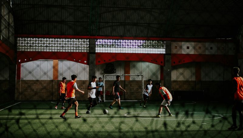 Indoor futsal match between two youth teams